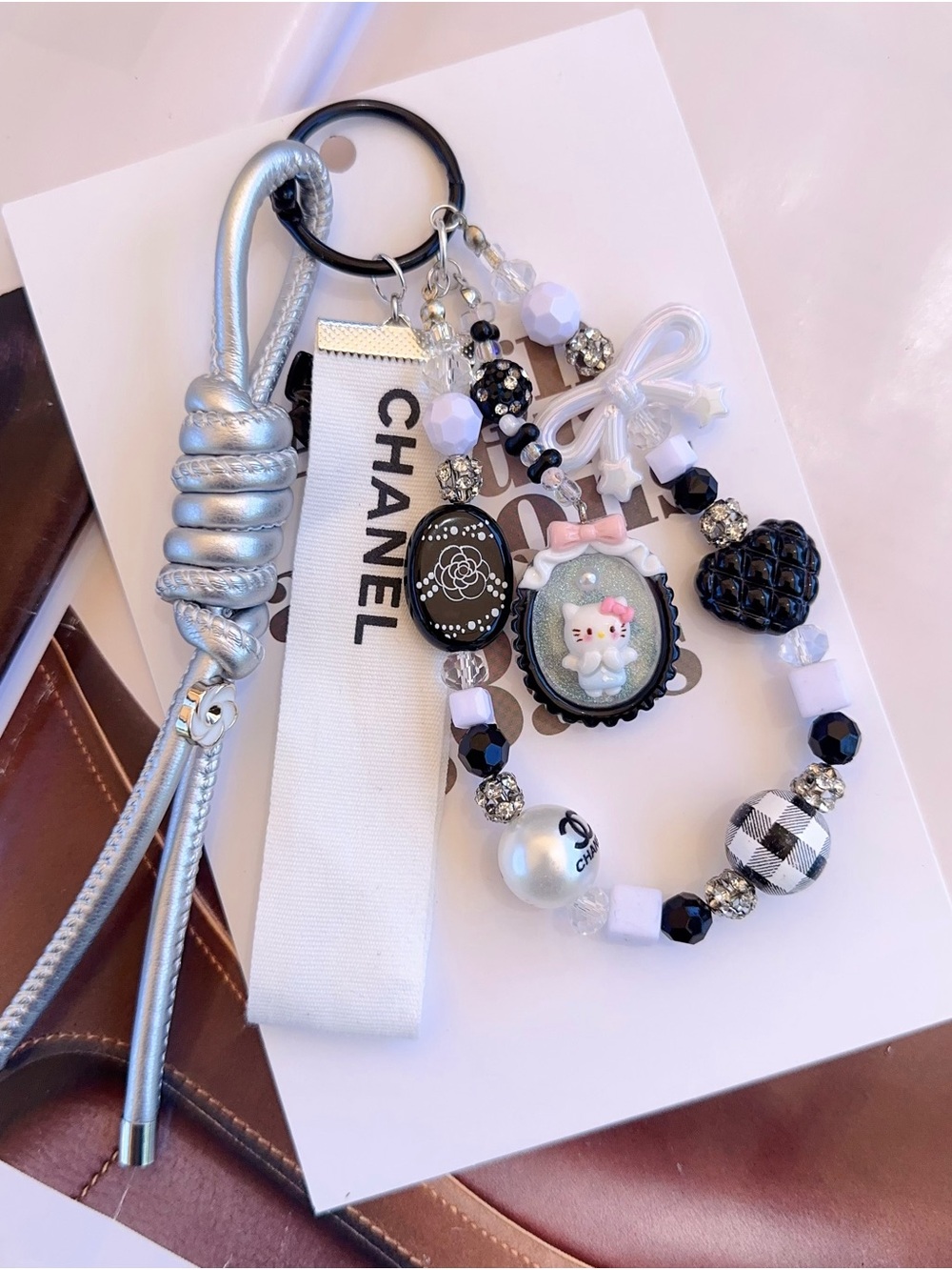 Authentic CC Ribbon with unbranded White & Black Beaded Bag Charm - Picture 2 of 4
